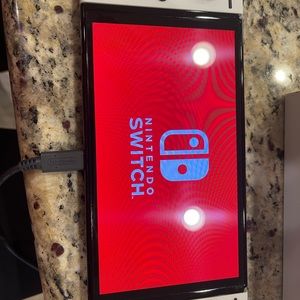 Nintendo Switch (OLED) Handheld and Console bundle with 3 games!